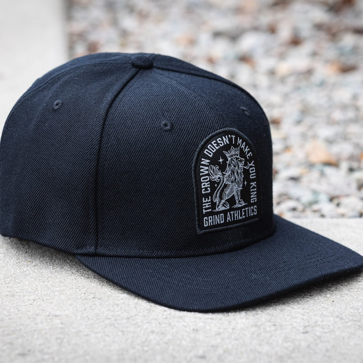 The Grind Athletics Flexfit CROWN DOESN'T MAKE YOU KING Hats